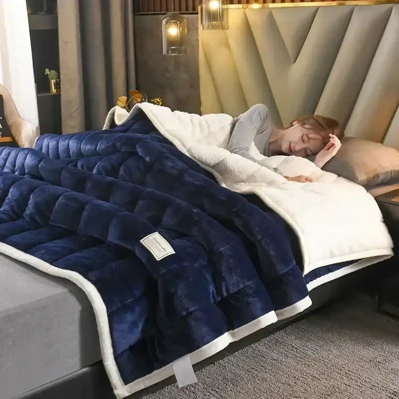 Deep blue and white cozy flannel fleece bedroom quilt with stitched diamond pattern and soft flannel fleece lambswool interior