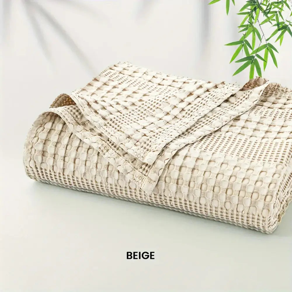 Beige woven cotton waffle blanket with textured grid pattern for lightweight decorbites bamboo cotton throw