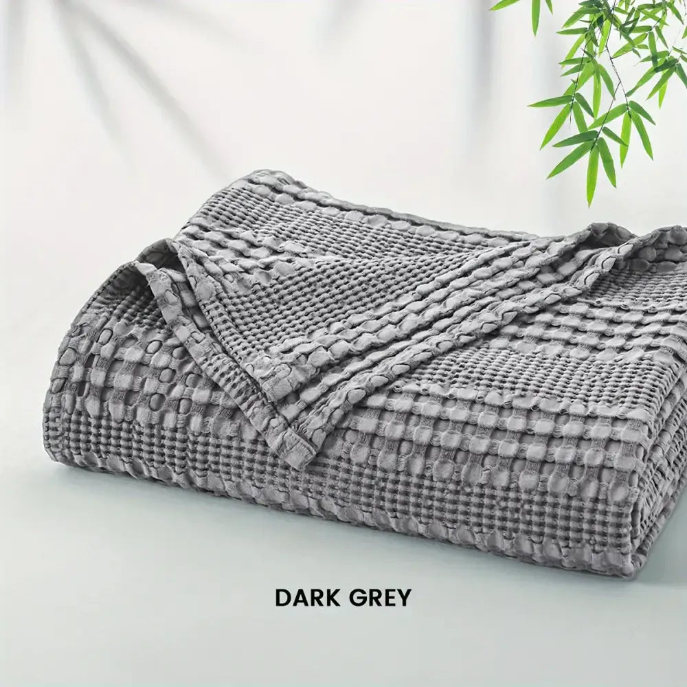 Dark grey cotton waffle blanket made of bamboo cotton waffle fabric ideal for lightweight bedroom decorbites throw