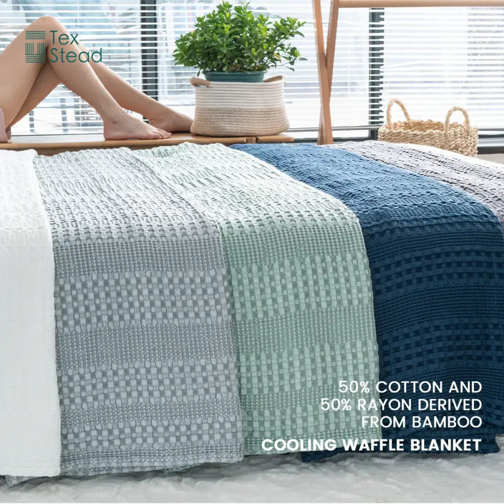Deep blue bamboo cotton waffle blanket in soothing white gray mint green and navy blue for lightweight decorbites use