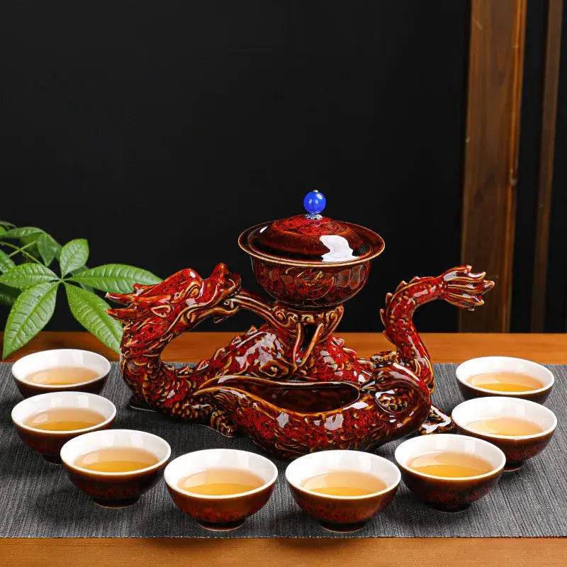 Glossy deep red ceramic dragon-shaped teapot with golden details and blue knob for decorbites dragon kung kung fu tea set