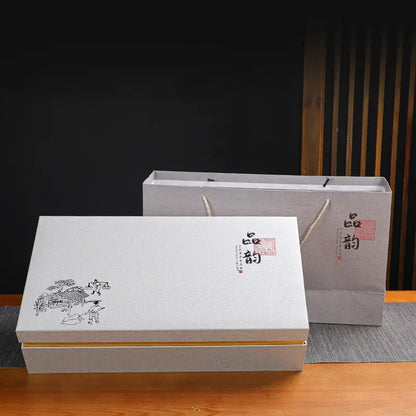White rectangular gift box with black ink illustration and red seal with gray paper bag for deep blue ceramic dragon kung fu tea set decorbites dragon kung