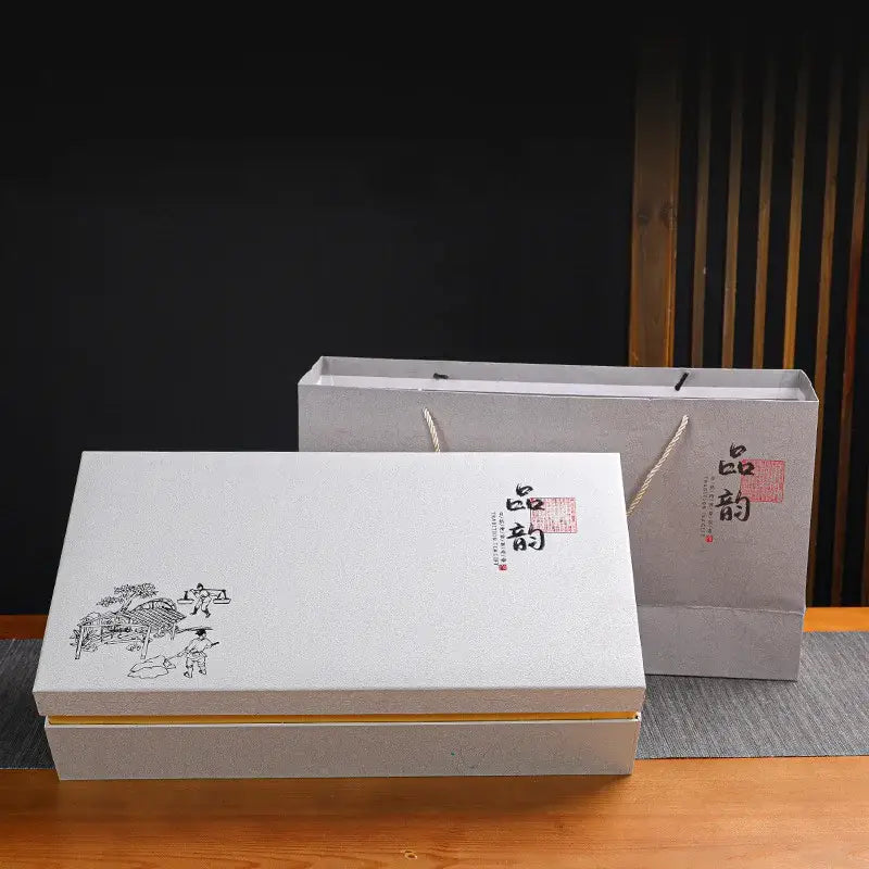 White rectangular gift box with black ink illustration and red seal with gray paper bag for deep blue ceramic dragon kung fu tea set decorbites dragon kung