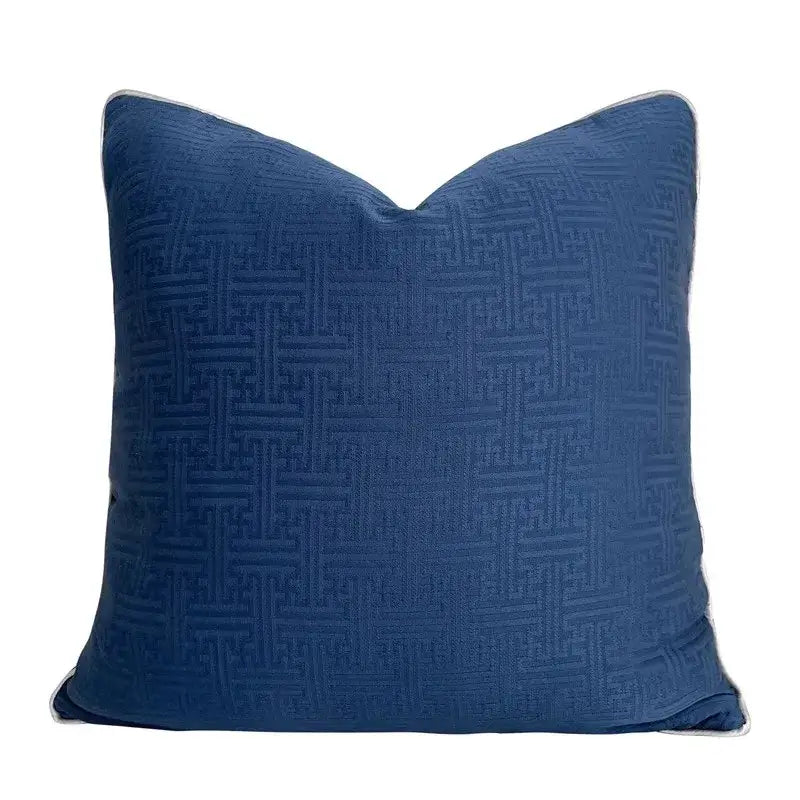 Deep blue cushion cover with subtle woven geometric jacquard pattern and light gray piping for living room decorbites decor
