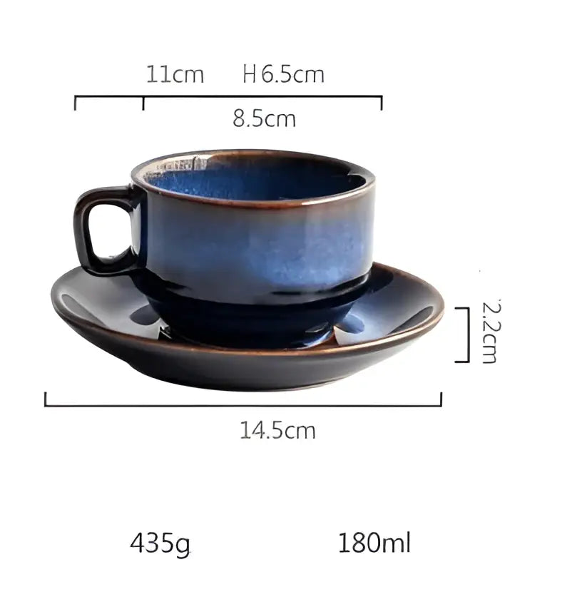 A deep blue glossy ceramic espresso coffee cup with subtle brown rim accents and matching coffee cup saucer set