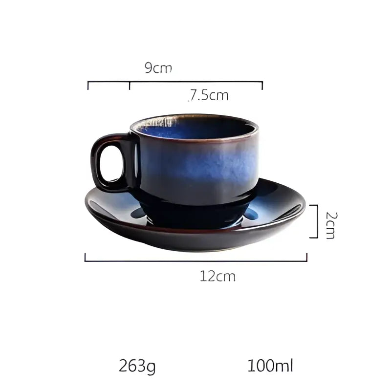 A sleek glossy deep blue ceramic espresso coffee cup and matching coffee cup saucer set for dining room use
