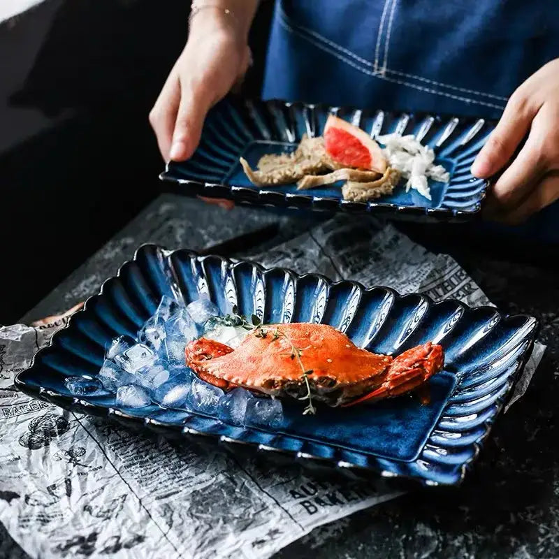 Deep blue klin glazed ceramic rectangle sushi tray with scalloped ridged edge and glossy finish for dining room decorbites klin glazed