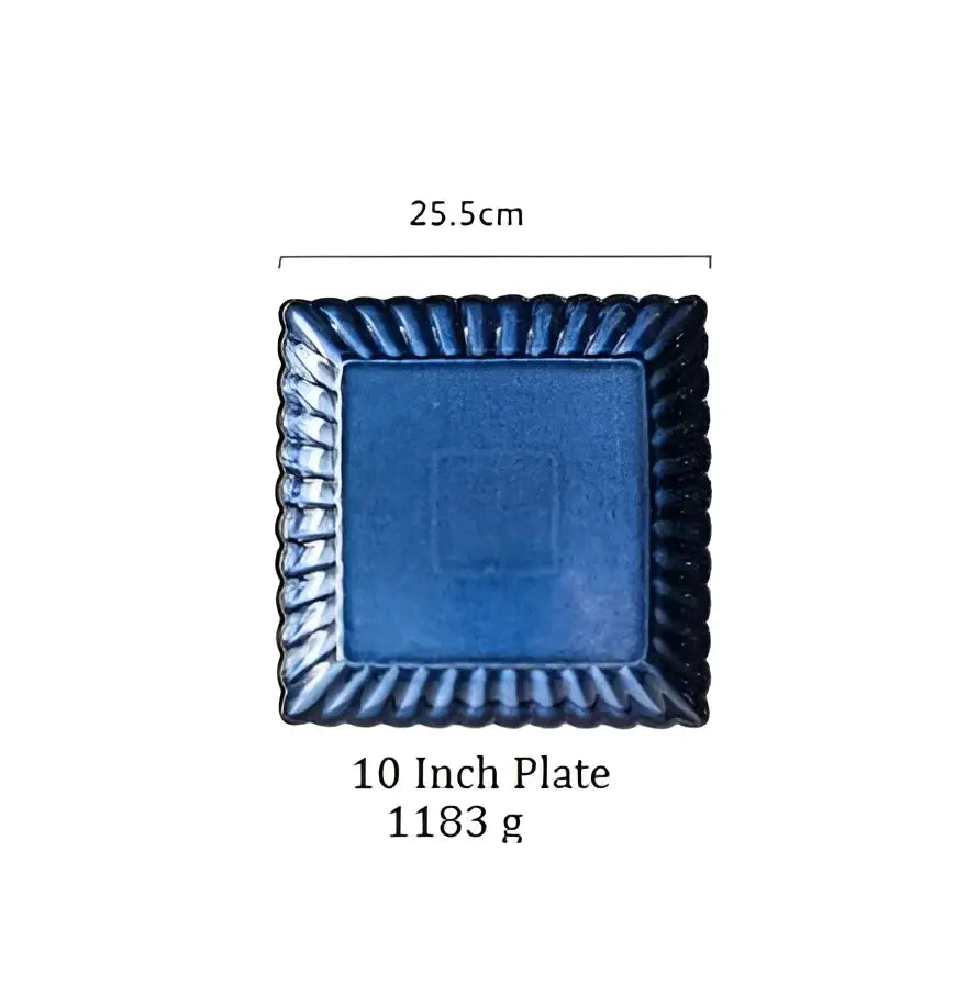 A klin glazed ceramic rectangle sushi tray with deep blue glaze and ornate twisted border from decorbites klin glazed collection