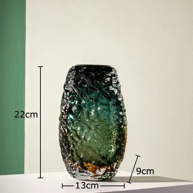 A tall deep green glass vase with textured gradient and gold accents perfect for living room decorbites decor