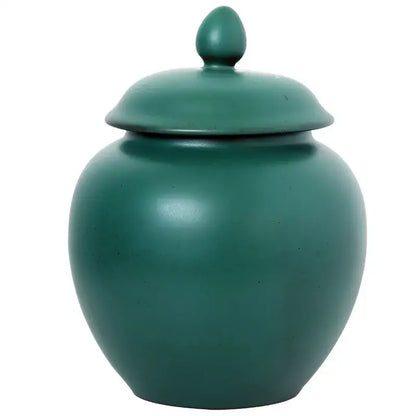 Deep green ceramic tea caddy jar with matte finish and egg-shaped finial for kitchen storage container