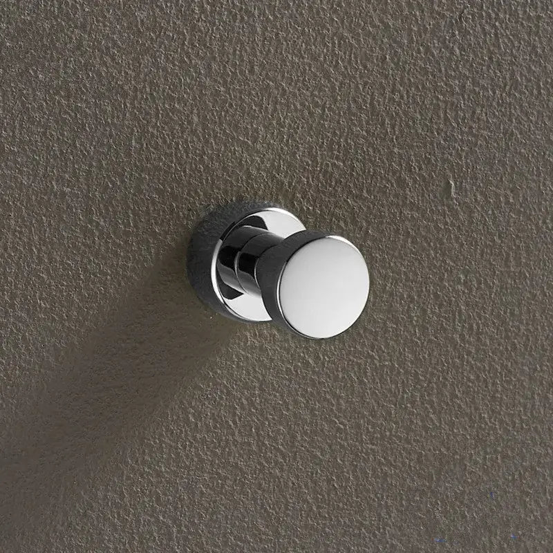 Chrome-finished brass wall mount robe hook with sleek rounded head and circular base for decorbites brass wall use