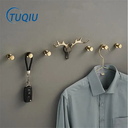 Gold-toned deer antler brass wall mount robe hook with sleek metallic finish for bathroom towel holder decorbites brass wall
