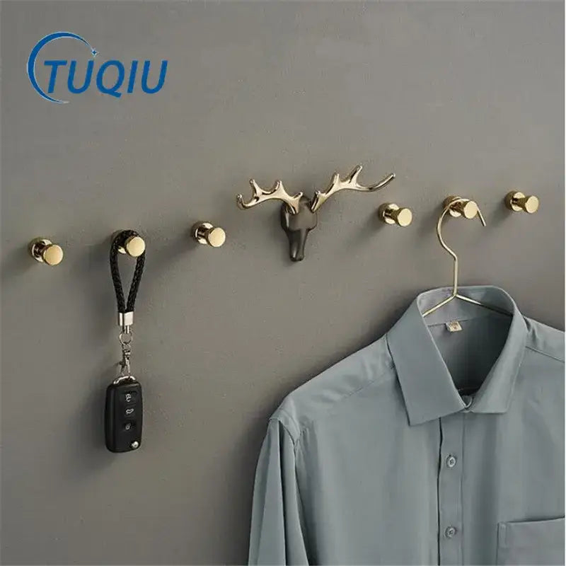 Gold-toned deer antler brass wall mount robe hook with sleek metallic finish for bathroom towel holder decorbites brass wall