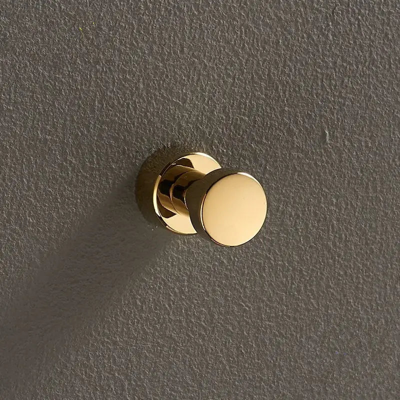 Gold-colored round knob-style decorbites brass wall mount robe hook with polished finish for bathroom towel holder