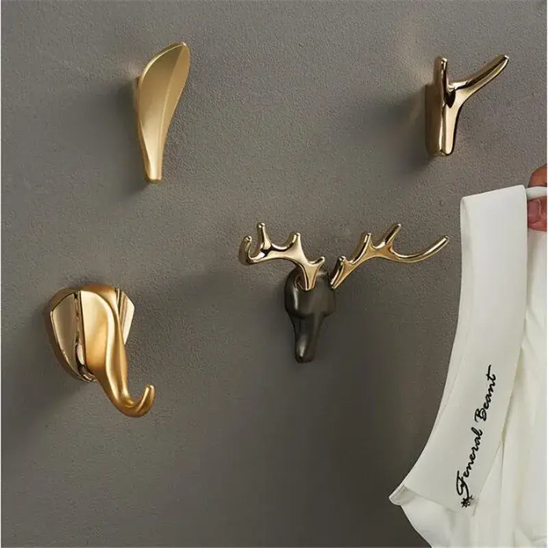 Gold-toned brass wall mount deer head robe hook with blackened face and antlers for bathroom decorbites brass wall use