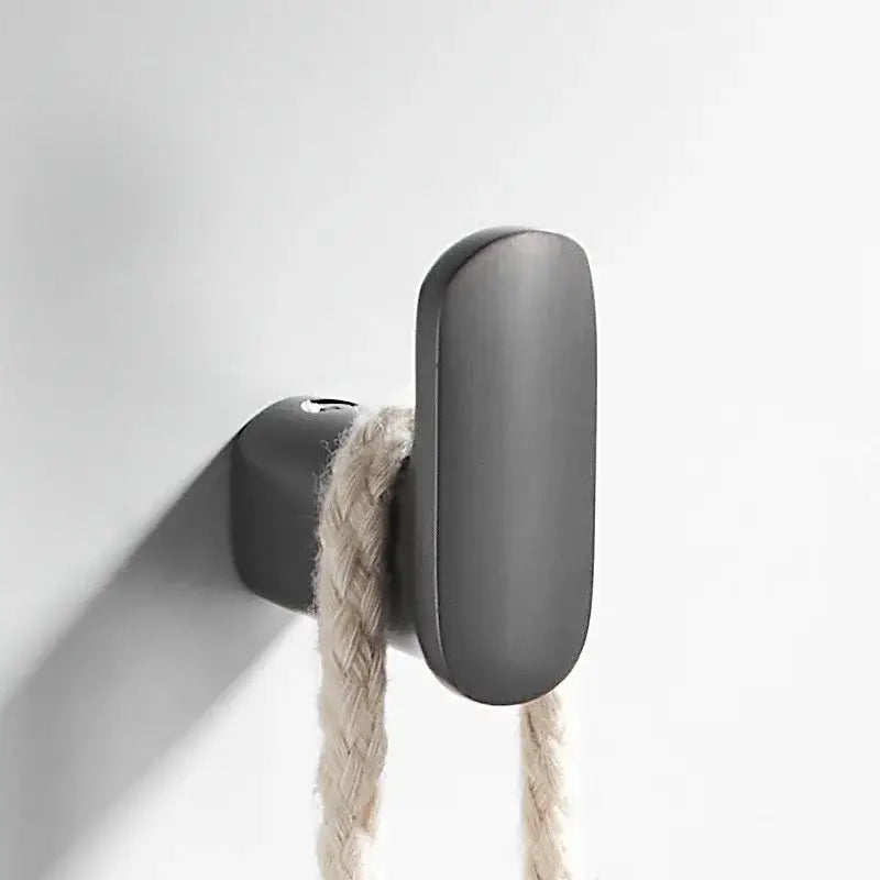 Matte black deer head gun grey robe hook with elongated oval shape holding beige braided rope for bathroom decorbites gun grey
