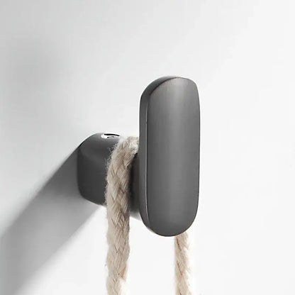 Matte black deer head gun grey robe hook with elongated oval shape holding beige braided rope for bathroom decorbites gun grey