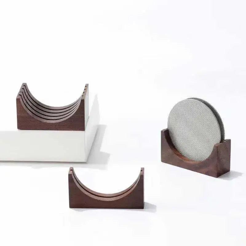 Dark wood coaster holder with textured gray circular insert featuring decorbites espresso puck screen design