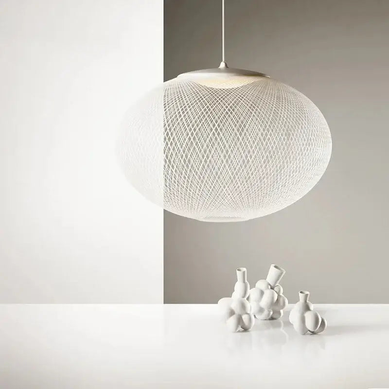 White spherical designer pendant lamp with delicate woven mesh design for dining room decorbites designer pendant
