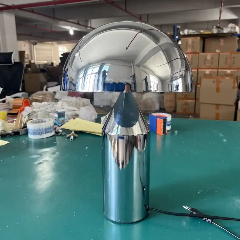 Shiny chrome-finished decorbites designer mushroom desk lamp with dome-shaped shade and cylindrical base in black and gold