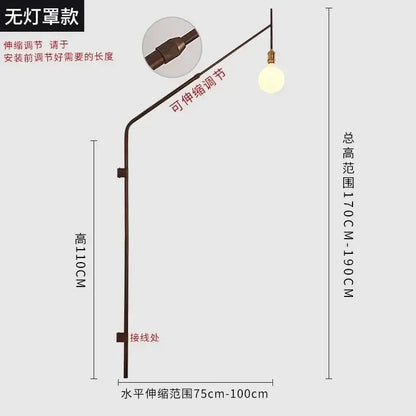 Adjustable bronze-finished swing arm wall lamp with spherical bulb ideal for bedroom reading decorbites gold black style