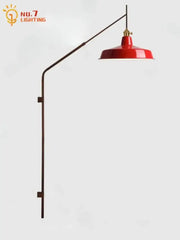 Designer red enamel wall lamp with brass gold black swing arm and curved metal fixture for bedroom reading light decorbites gold black