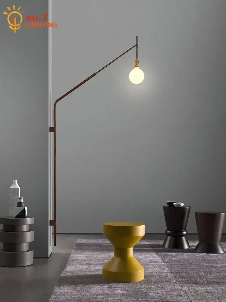 A sleek curved wall lamp with gold black swing arm and warm bulb designed for bedroom reading decorbites gold black