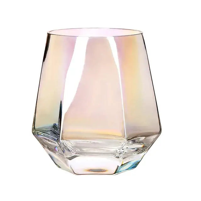 Diamond crystal glass tumbler with geometric faceted design and iridescent rainbow reflections for glass water use