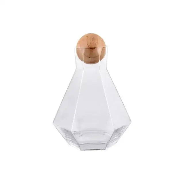 Clear glass water carafe with faceted diamond crystal glass design and round wooden stopper for dining room use
