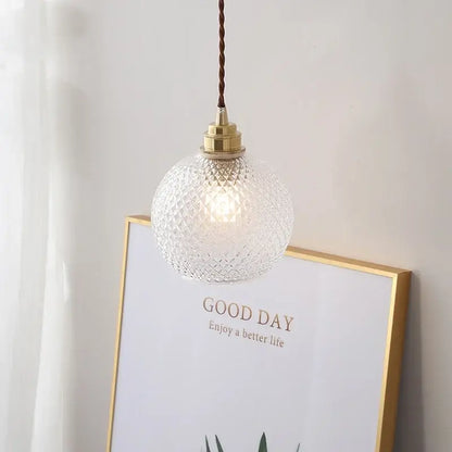 Clear textured glass globe led pendant light with brass finish and twisted brown cord for kitchen decorbites glass globe