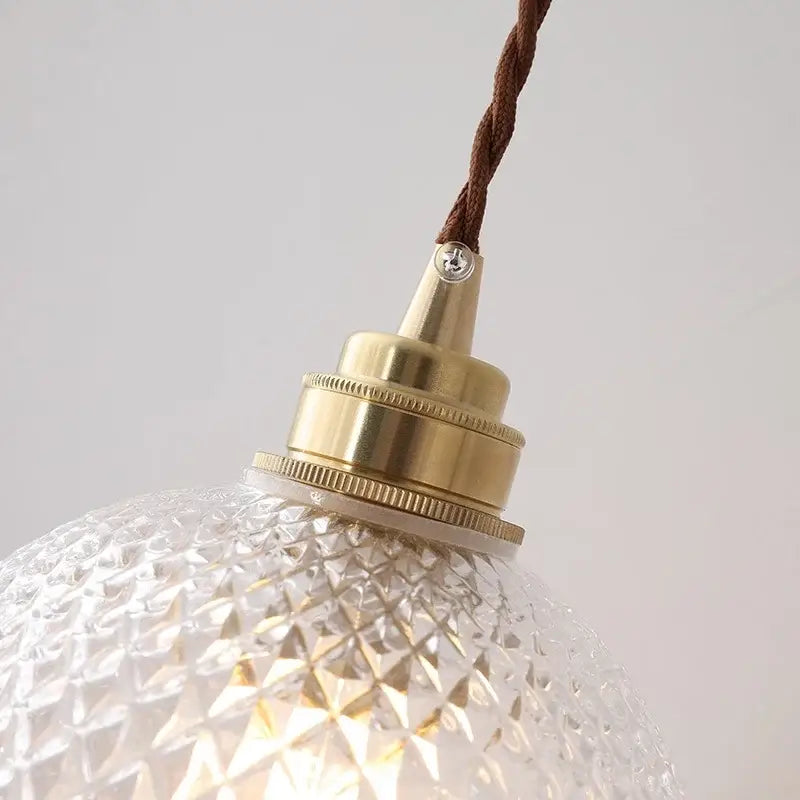 Diamond cut glass globe led pendant light with clear faceted glass globe and brass-finished fixture for kitchen decorbites pendant light
