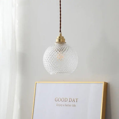 Clear glass globe led pendant light with diamond cut pattern and brass hardware for kitchen decorbites pendant light