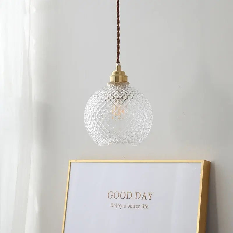 Clear glass globe led pendant light with diamond cut pattern and brass hardware for kitchen decorbites pendant light
