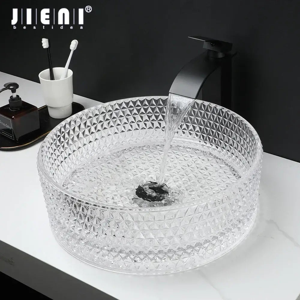 Clear glass diamond glass basin with geometric pattern and matte black faucet in bathroom basin set