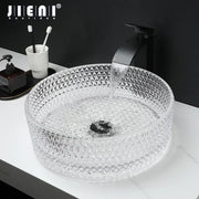 Clear glass diamond glass basin with geometric pattern and matte black faucet in bathroom basin set
