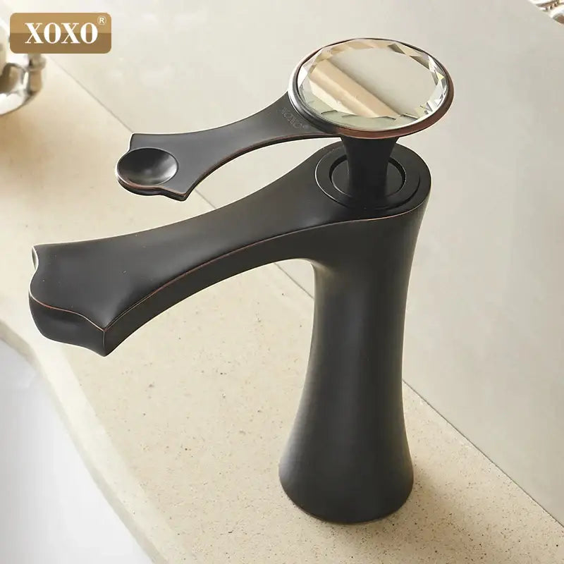 Diamond golden black basin faucet with black matte finish and faceted crystal knob by xoxo brand for bathroom use
