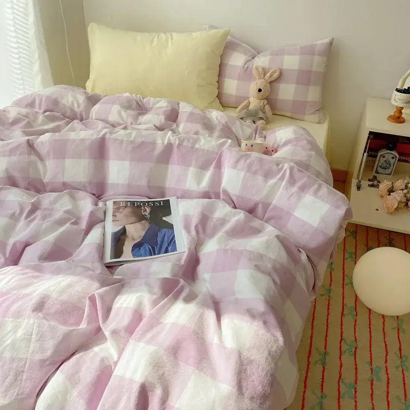 Pink and white gingham duvet cover with soft textured fabric complementing a cream diamond jacquard duvet cover design