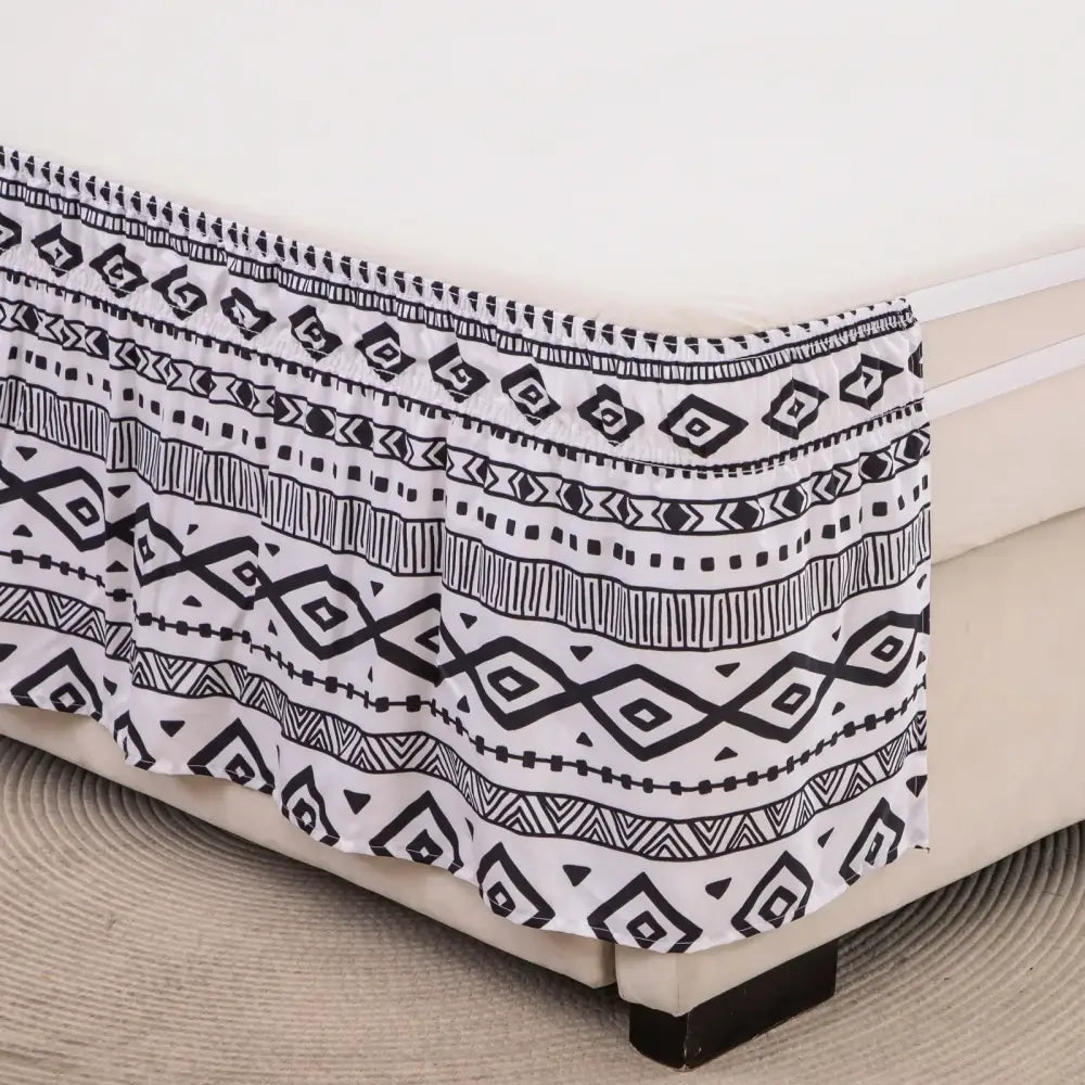 Black and white bed skirt with diamond lattice ruffled design and elastic band for a stylish bedroom look