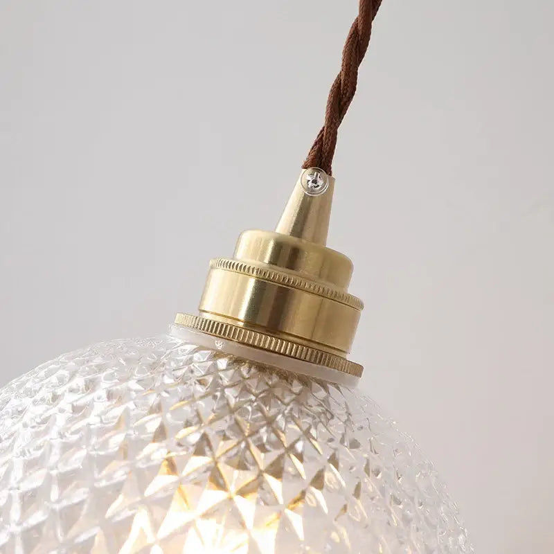 Clear glass pendant light with diamond pattern and brass fixture featuring decorbites glass ball led for dining room decor