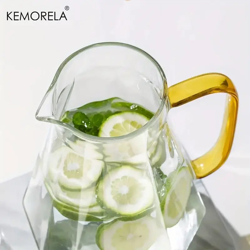 Clear glass teapot set with diamond texture and gold accents featuring a golden-yellow handle filled with lime and mint