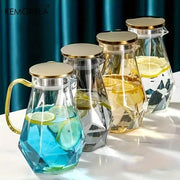 Clear glass teapot set with diamond texture and gold-toned lids and handles for elegant dining room use