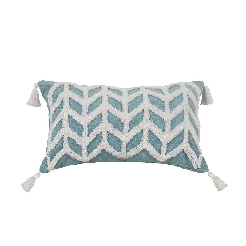 Teal and white woven chevron cushion cover with tassels featuring a diamond tufted blue pattern for living room decor
