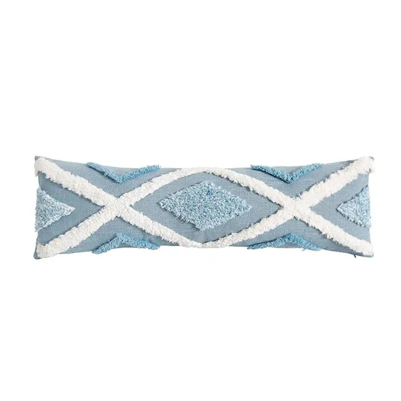 Light blue diamond tufted blue cushion cover with white fringed geometric patterns and tassels for living room decor