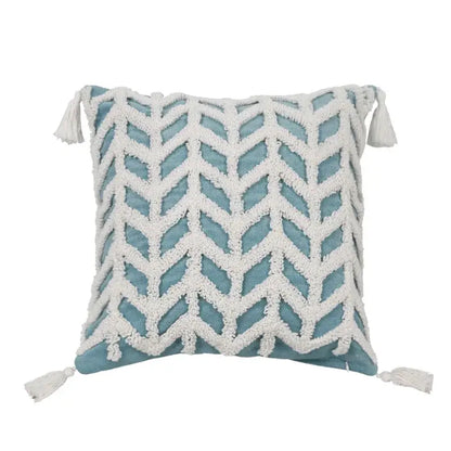 Diamond tufted blue and white cushion cover with woven chevron pattern and tassels for living room decor
