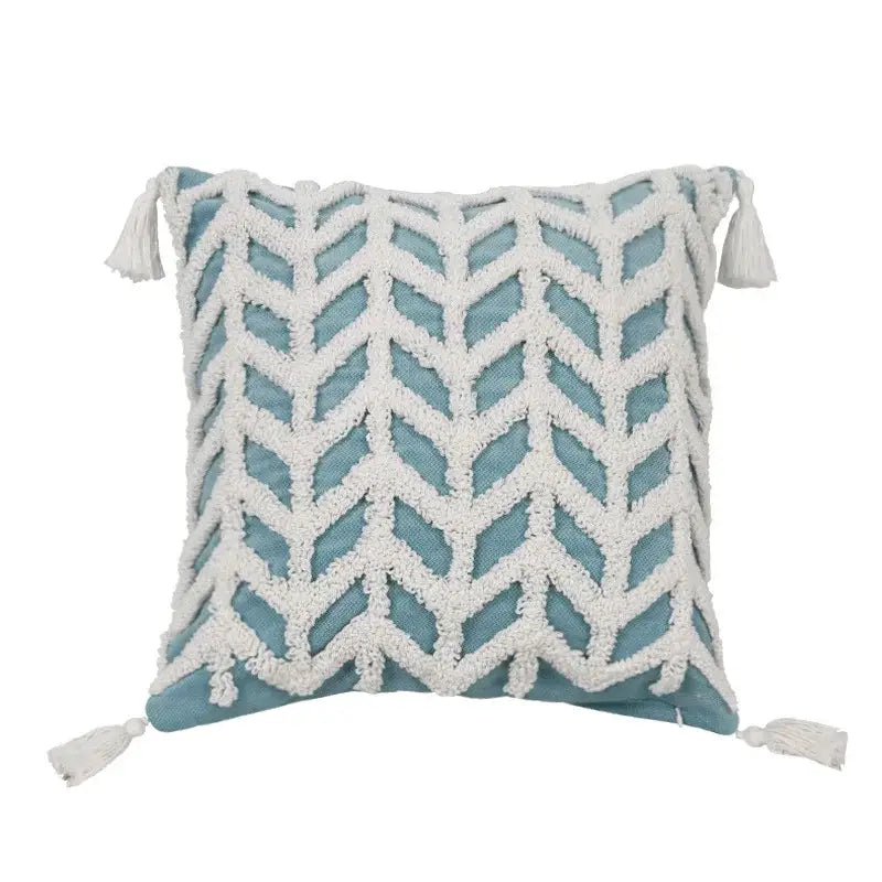 Diamond tufted blue and white cushion cover with woven chevron pattern and tassels for living room decor