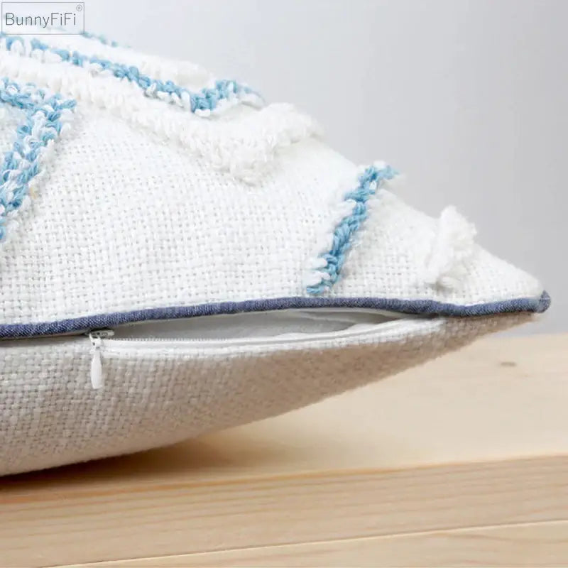 Diamond tufted blue and white cushion cover with white textured fabric light blue fringed embroidery and navy zipper trim