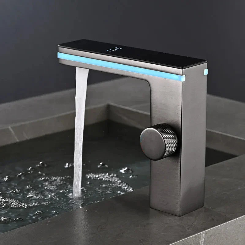 Modern matte black and brushed steel single hole deck mounted bathroom faucet with illuminated blue led strip for cold water