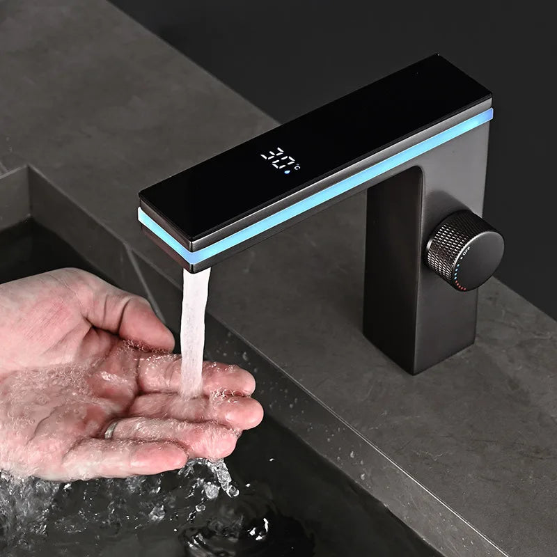 Modern matte black brass deck mounted single hole bathroom basin faucet with digital temperature display and blue led lighting