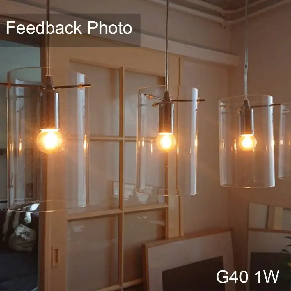 Clear cylindrical glass pendant lights with brass accents and vintage led filament bulbs for dimmable vintage decorbites lighting