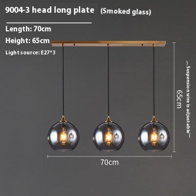 Smoked glass pendant light with wooden accents, 70cm long and adjustable suspension wires.